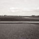 Archiv der Region Hannover, ARH NL Koberg 5565, Person im Watt und Häuser, Insel Neuwerk
