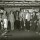 Stadtarchiv Neustadt a. Rbge., ARH Slg. Bartling 2885, Kooperative Gesamtschule (KGS), Lehrpersonal beim Stehkonvent in der Bibliothek mit Schulleiter Herbert Stoepper (2. v. r.), Neustadt a. Rbge.